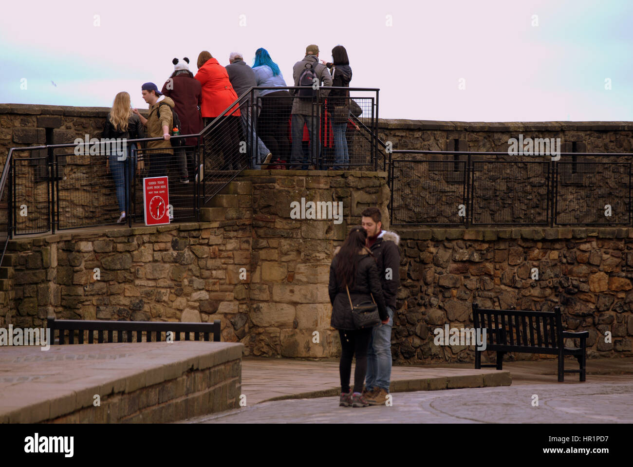 Edinburgh castle tourists on the ramparts inside the castle taking ...
