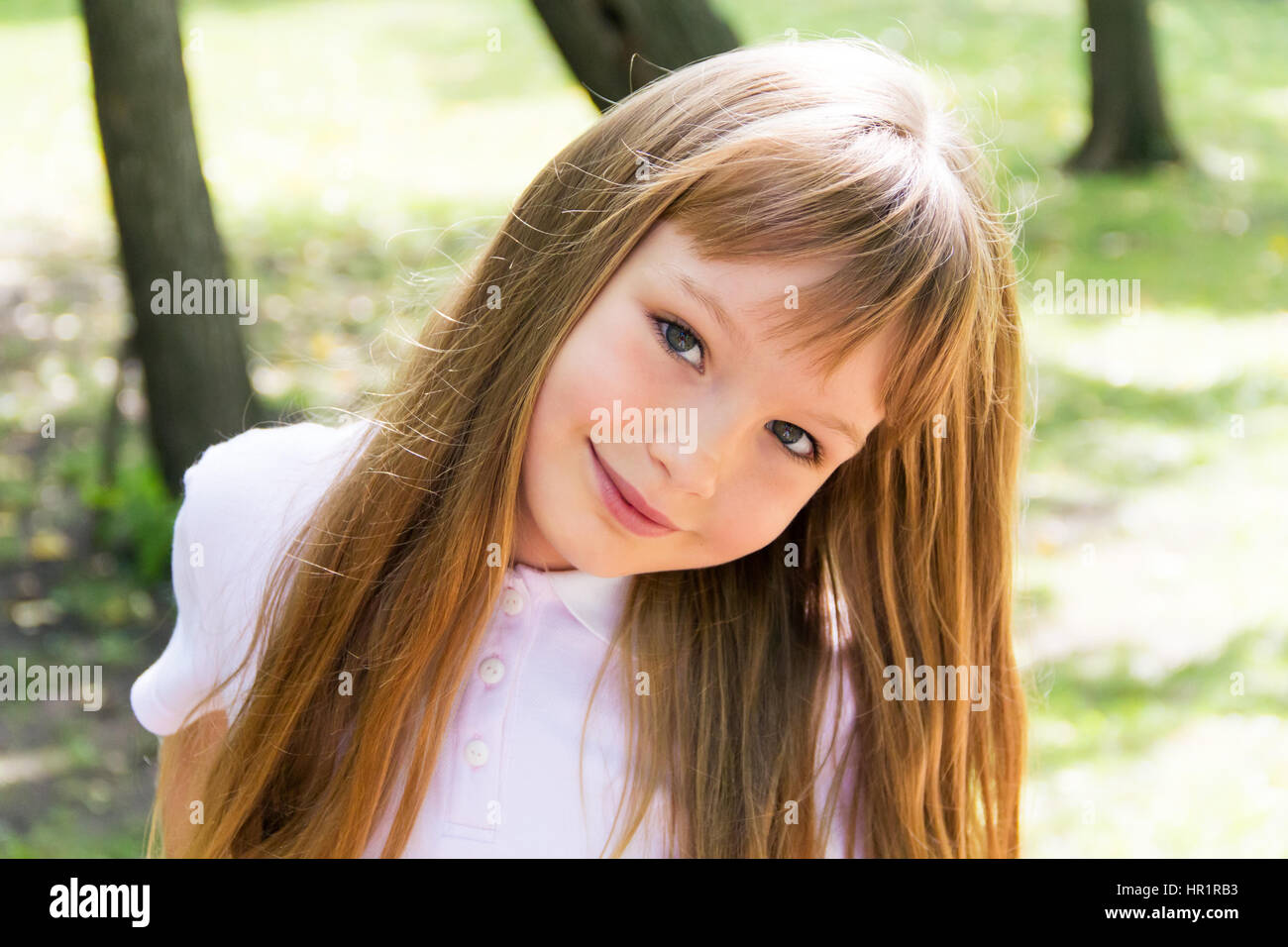 Photo of cute girl with long hair Stock Photo - Alamy