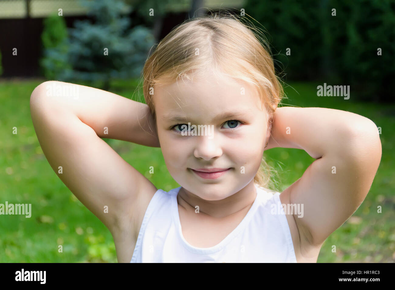 Cute girl with blond long hair and blue eyes Stock Photo - Alamy