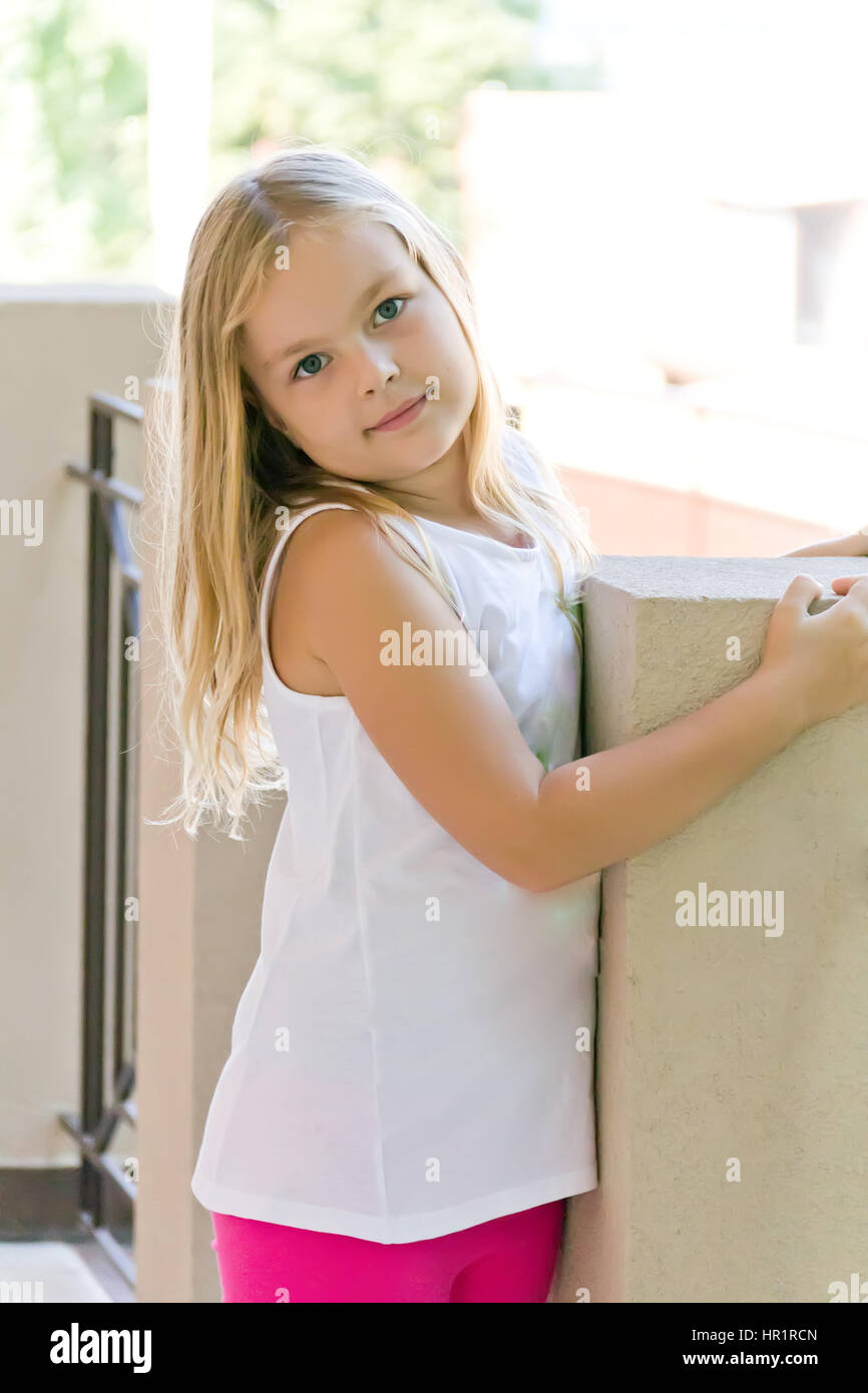 Cute girl with blond long hair and blue eyes Stock Photo - Alamy