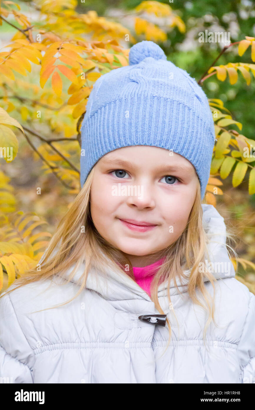 Photo of cute smiling girl in autumn Stock Photo - Alamy