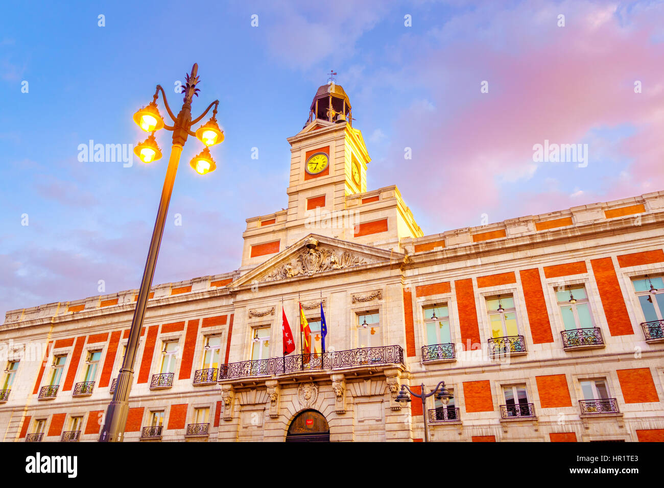 The Puerta del Sol square is the main public square in the city of Madrid, Spain. In the middle of the square is located the office of the President o Stock Photo