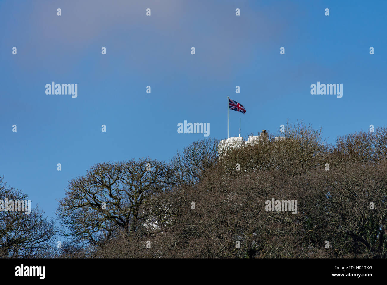 A Union Jack flag flies over Benton Castle at the upper reaches of the Cleddau in Pembrokeshire on a glorious winters morning Stock Photo