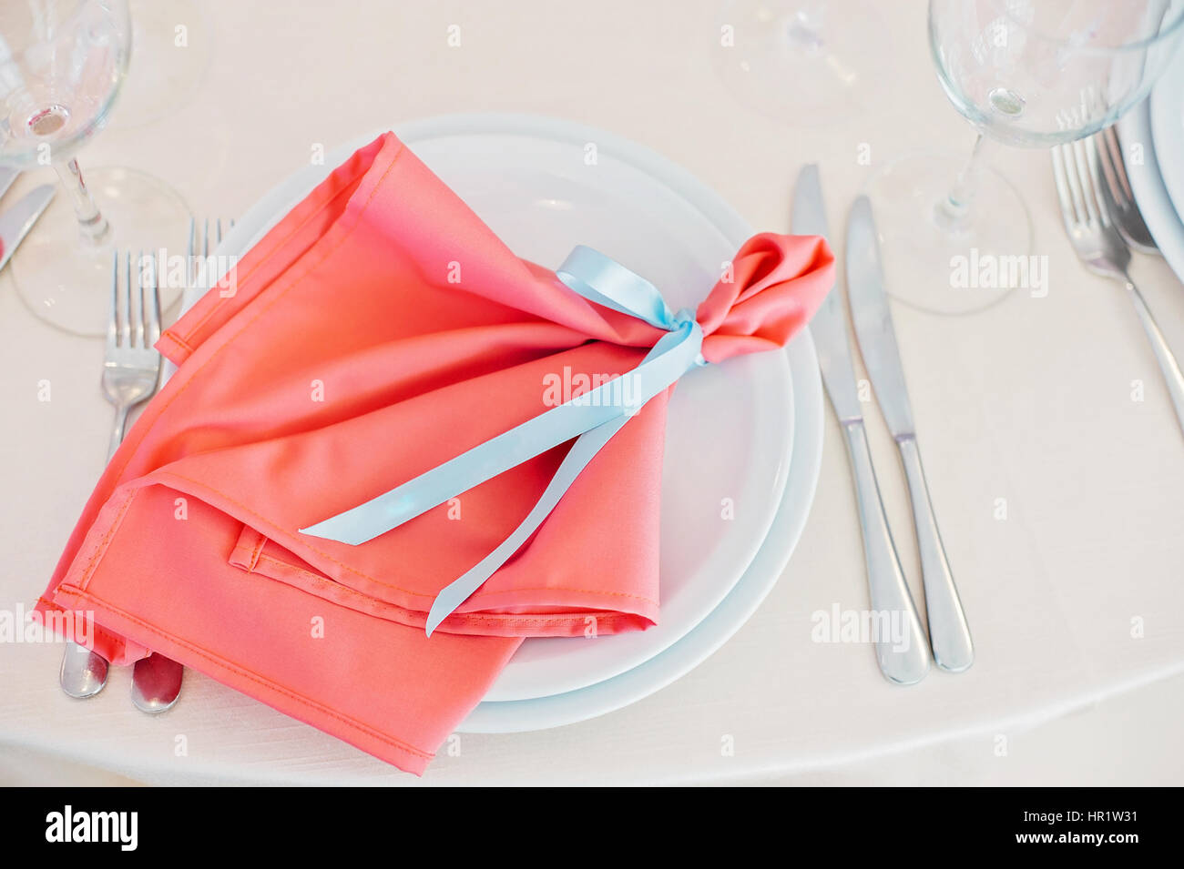 Decorated with blue ribbon with newlyweds names red napkin Stock Photo