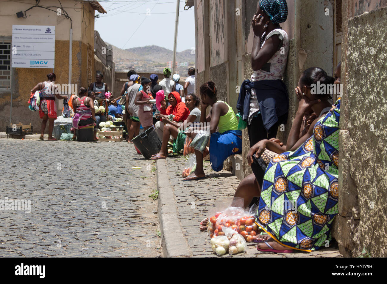 African women selling fruits and vegetables outdoors market in Praia, Cape Verde. Stock Photo