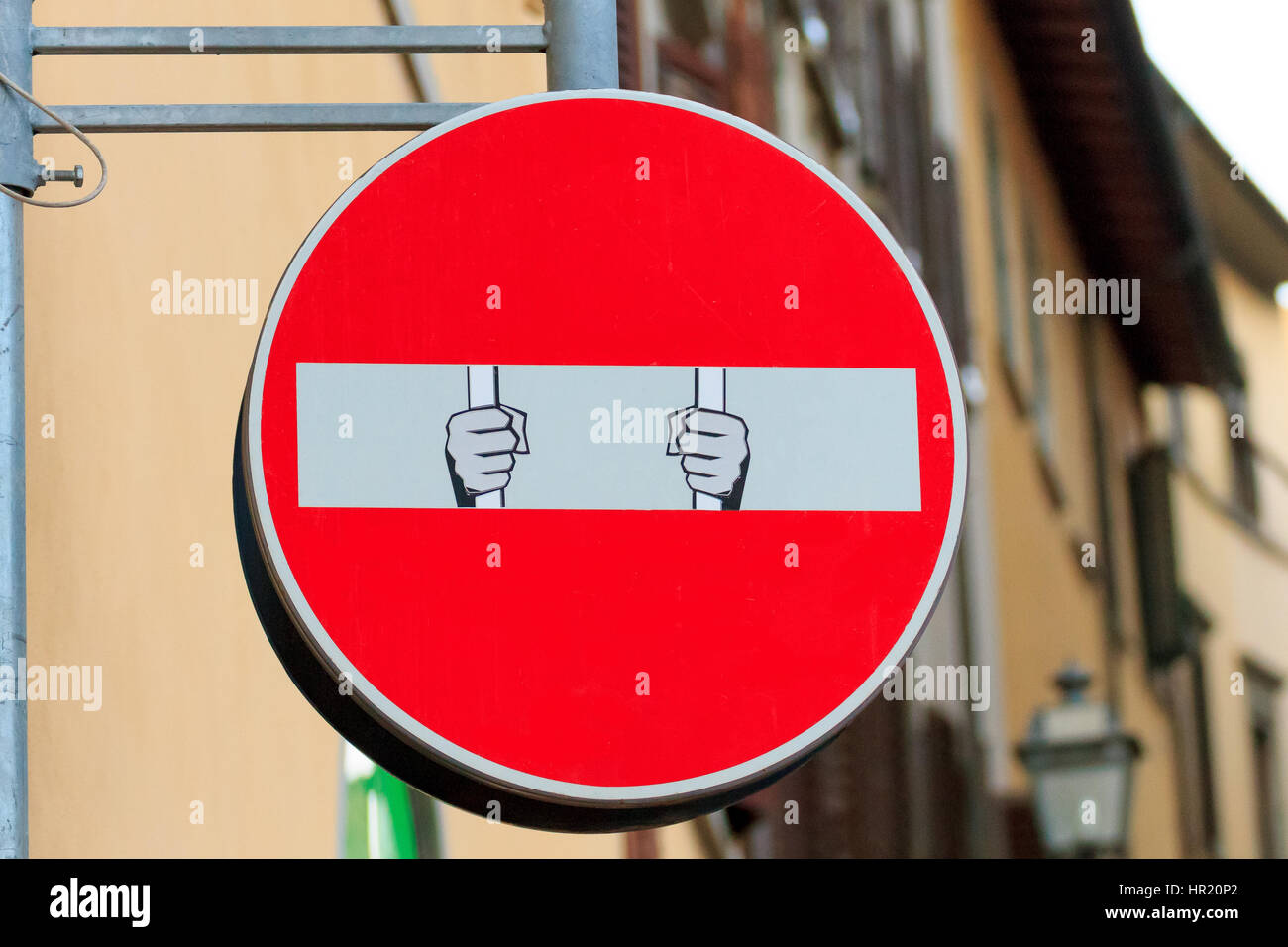 Road sign with an hand that break out the signal, street art ...
