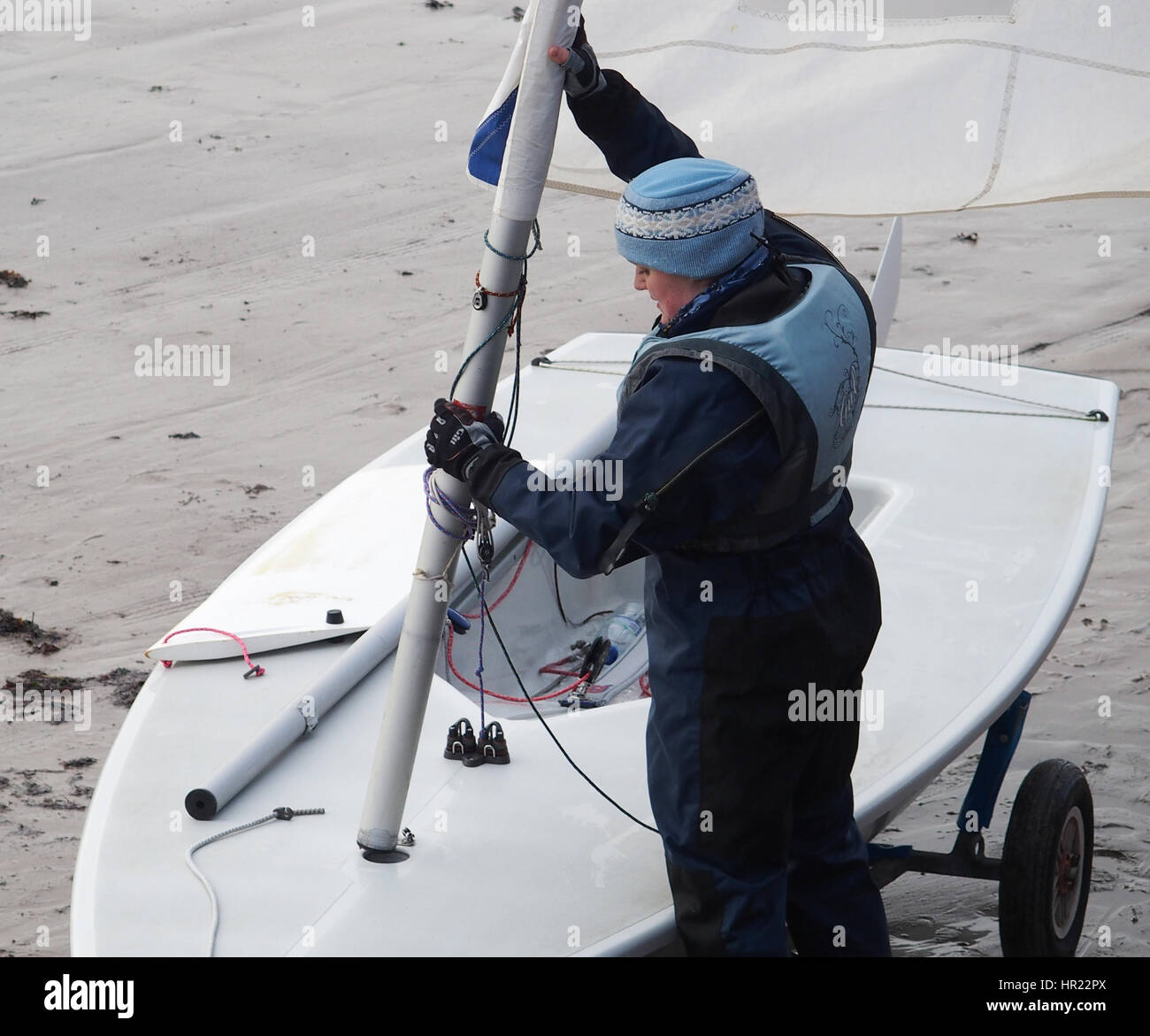 Woman rigging a Laser sailing Dinghy Stock Photo - Alamy