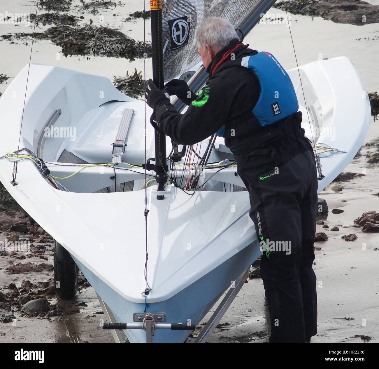 Man rigging a Hydron Sailing Dinghy Stock Photo Alamy