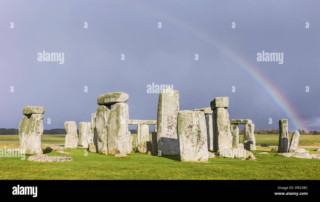Stonehenge, prehistoric monument of standing stones, set against a foreboding blue sunny sky in winter at Amesbury, Wiltshire, UK. Stock Photo