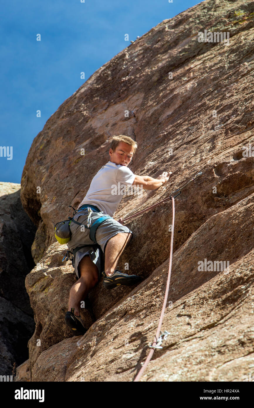 Young man rock climbing; Penitente Canyon; Colorado; US Stock Photo
