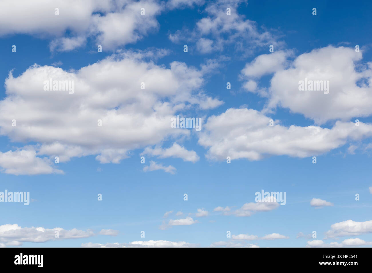 White fluffy clouds float on blue sky in Sunny day Stock Photo - Alamy