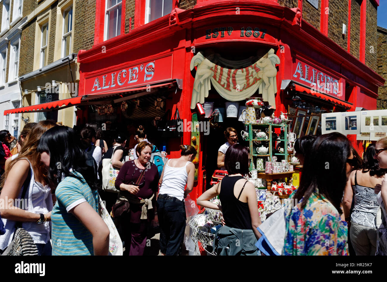 People looking at stalls on the busy Portobello road antique market in
