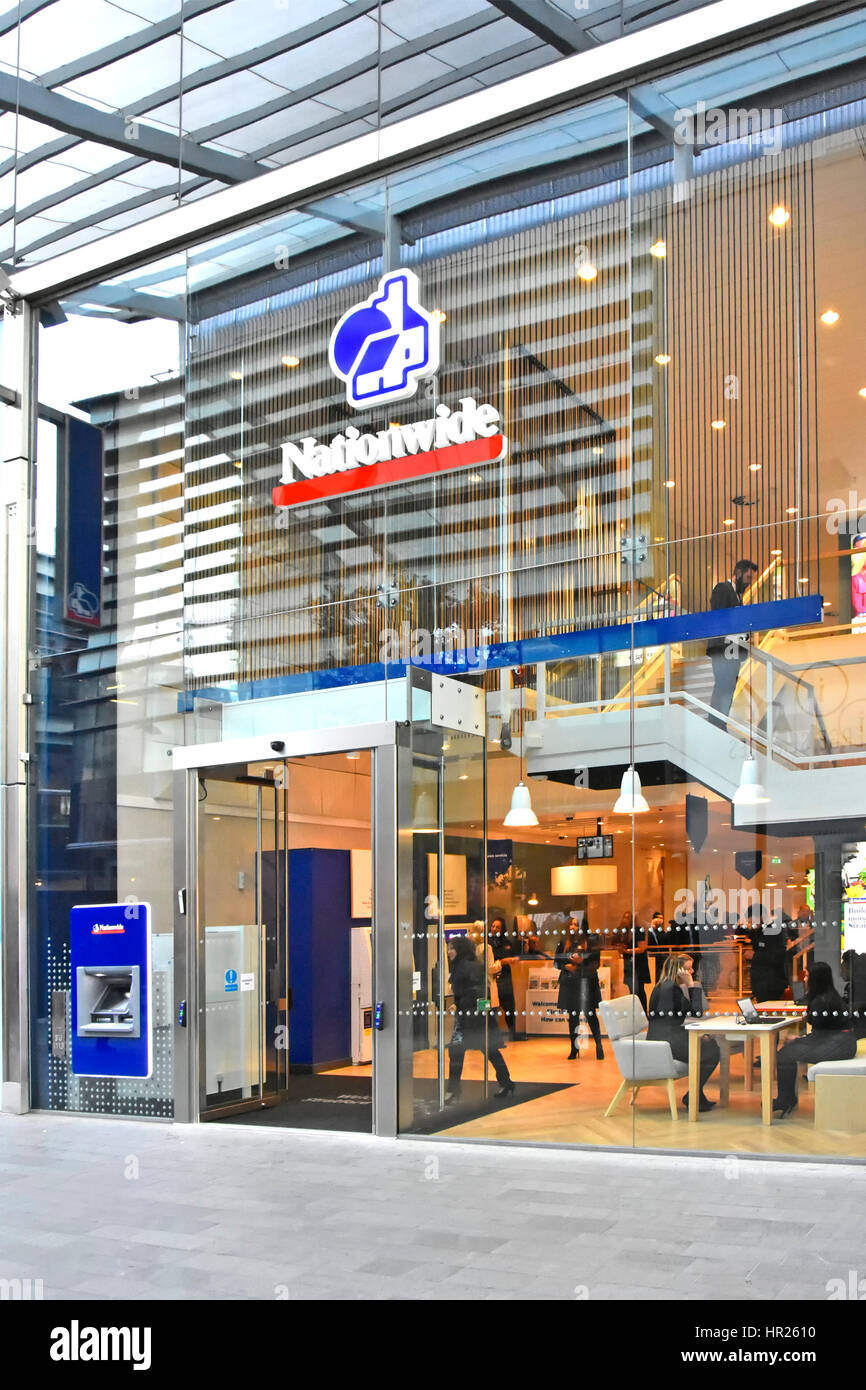 Glass front Nationwide building society premises & logo with ATM in shopping mall at Westfield shopping centre Stratford City Newham East London UK Stock Photo
