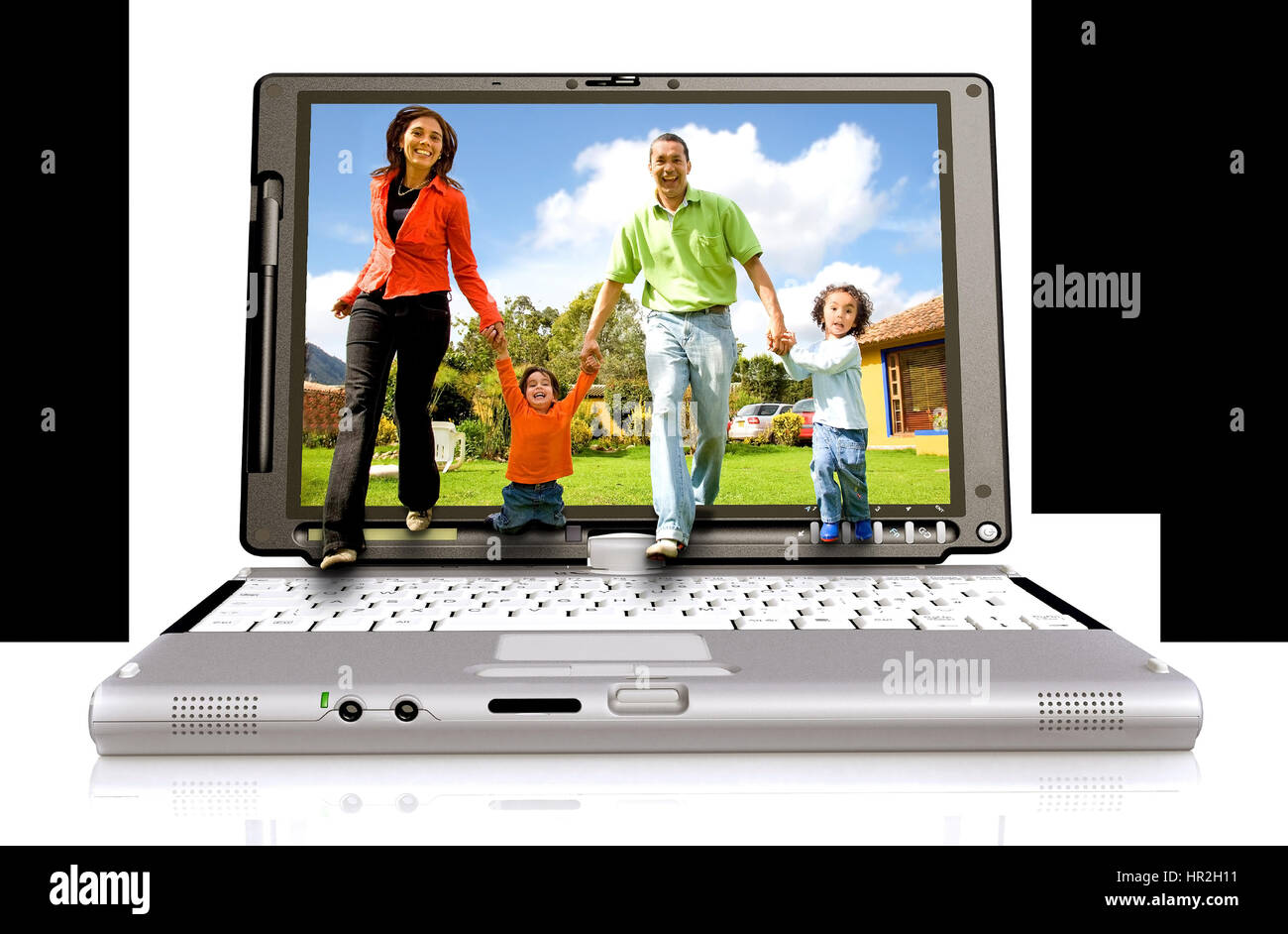 Happy family coming out of a laptop screen – isolated over white background Stock Photo
