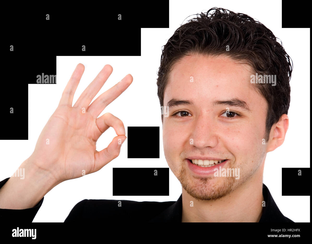 young man doing the ok sign over a white background Stock Photo - Alamy