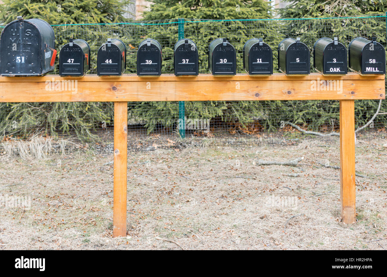 a bank of black mail boxes with numbers Stock Photo