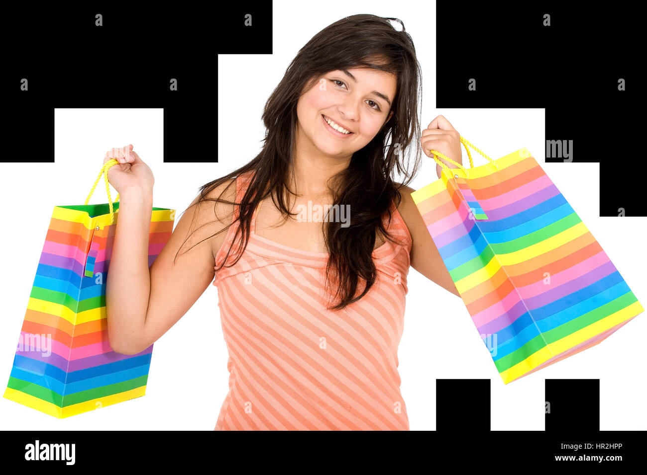 happy girl smiling holding shopping bags - isolated over a white ...
