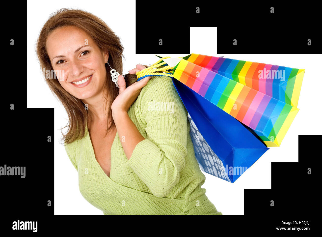 happy girl smiling holding shopping bags - isolated over a white ...