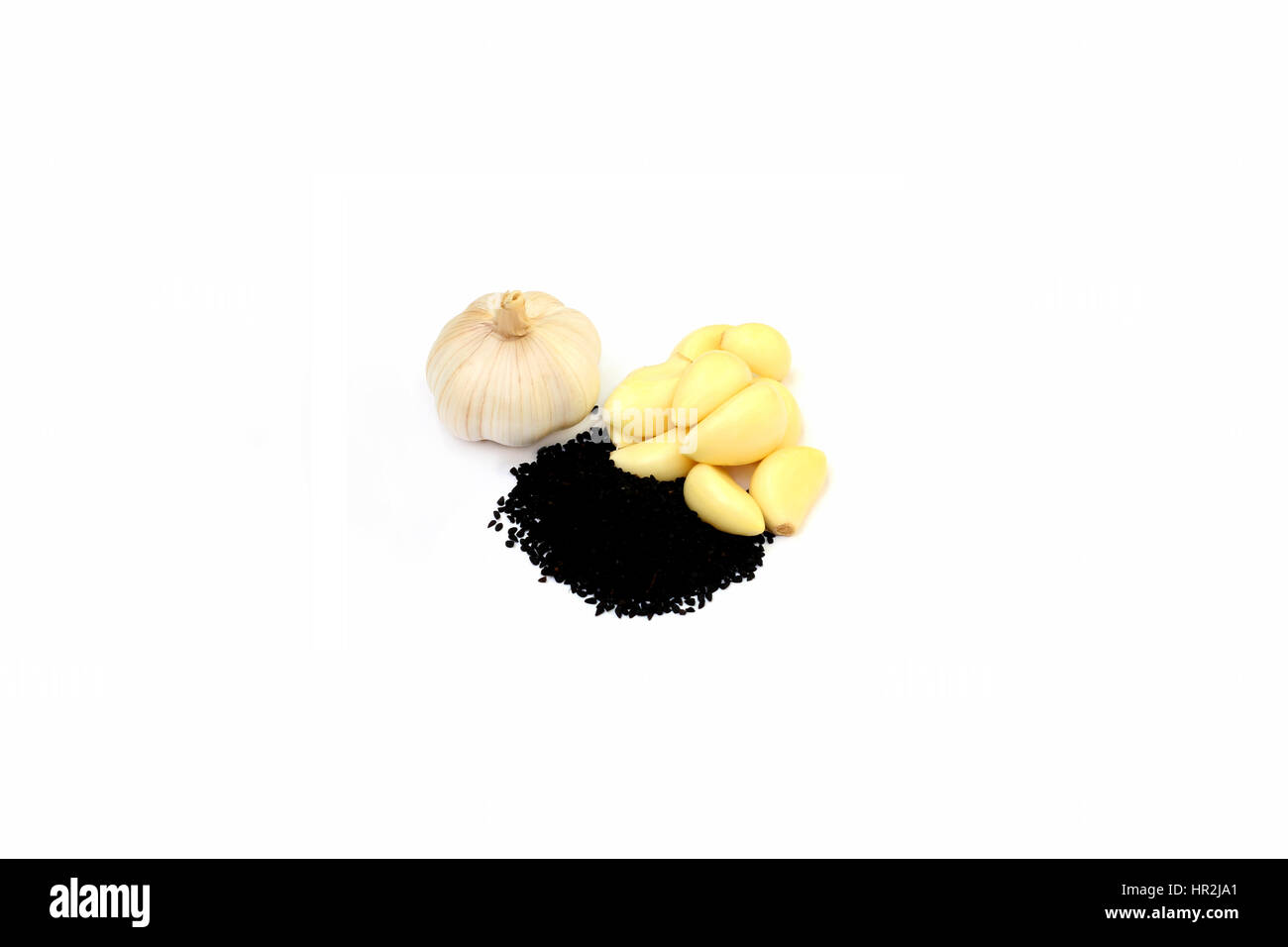 Fresh garlic  & black cumin over white background Stock Photo
