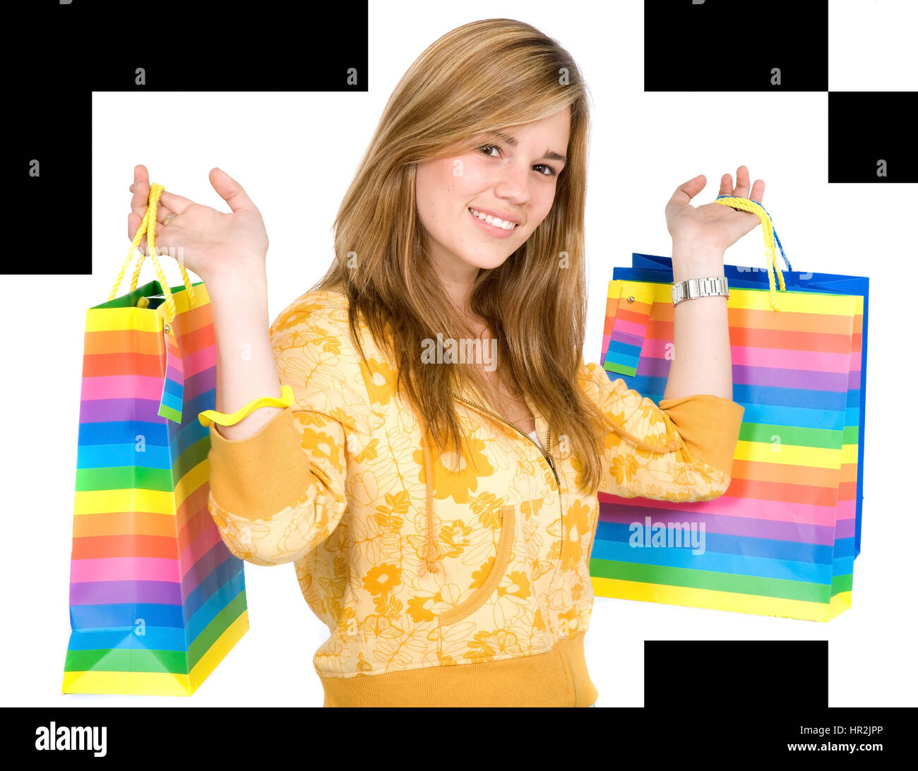 happy girl smiling holding shopping bags - isolated over a white ...