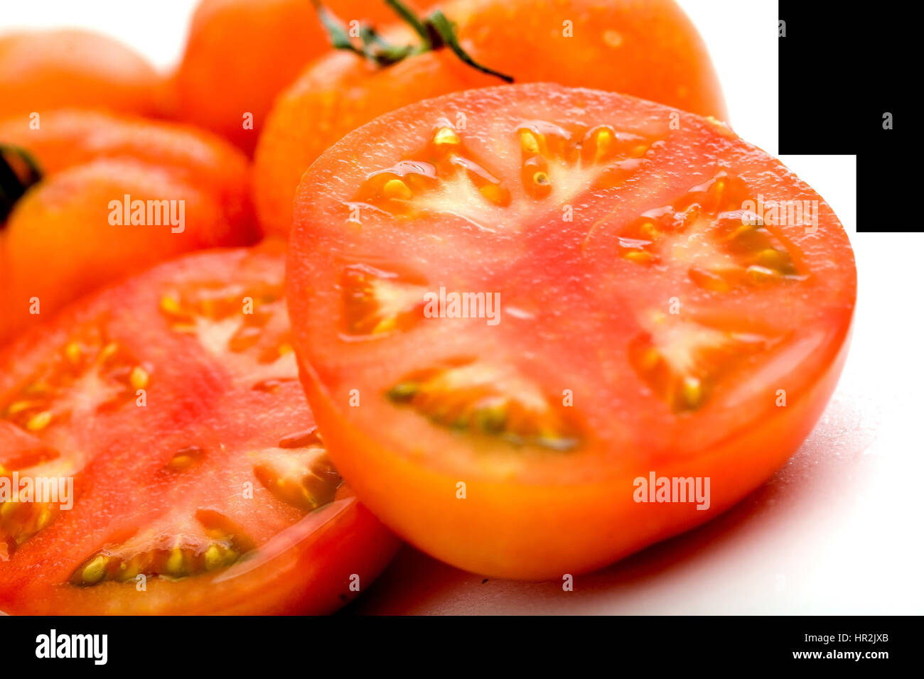 fresh red tomatoes isolated over a white background Stock Photo - Alamy