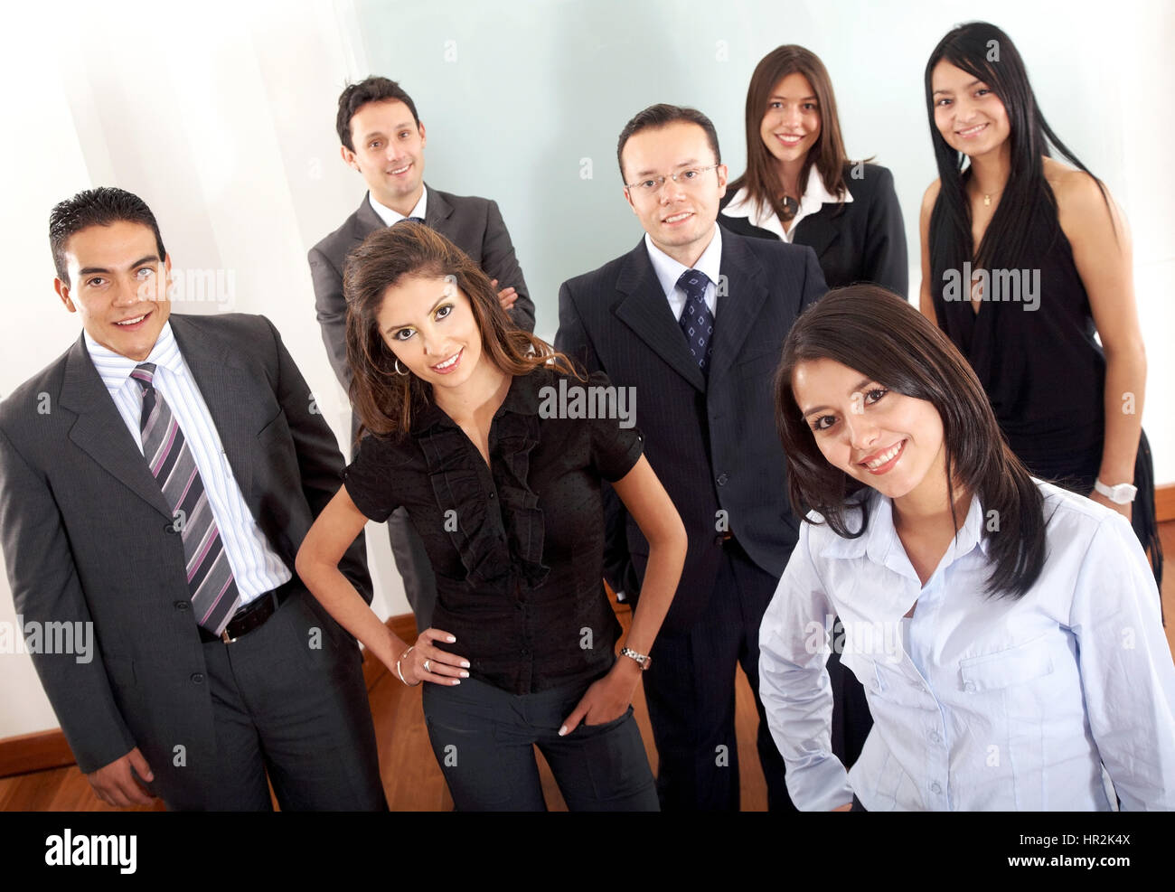 Business team in an office with a businesswoman leading Stock Photo - Alamy