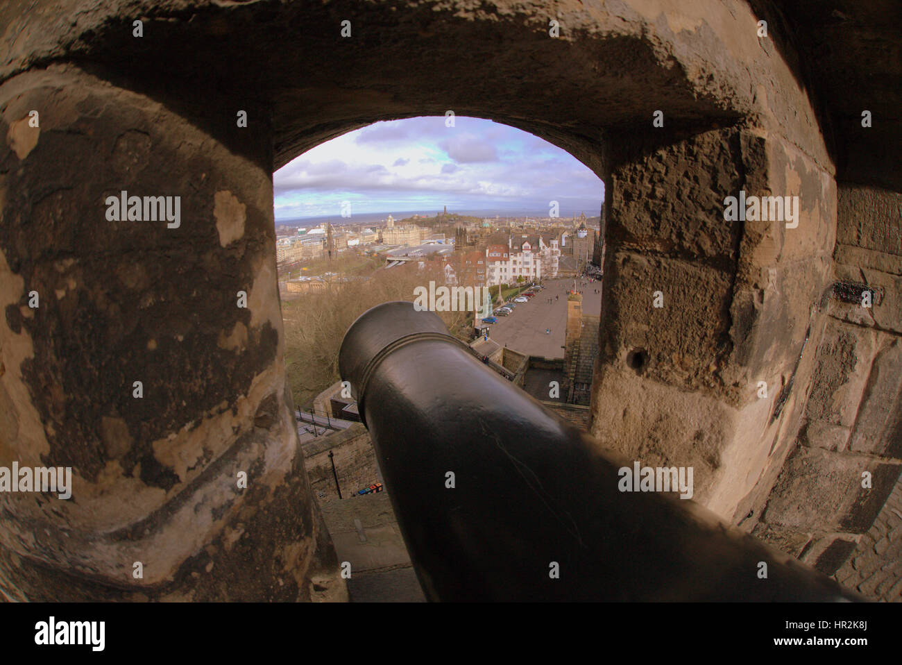canon through the gun ports cityscape view of Edinburgh from the castle Stock Photo