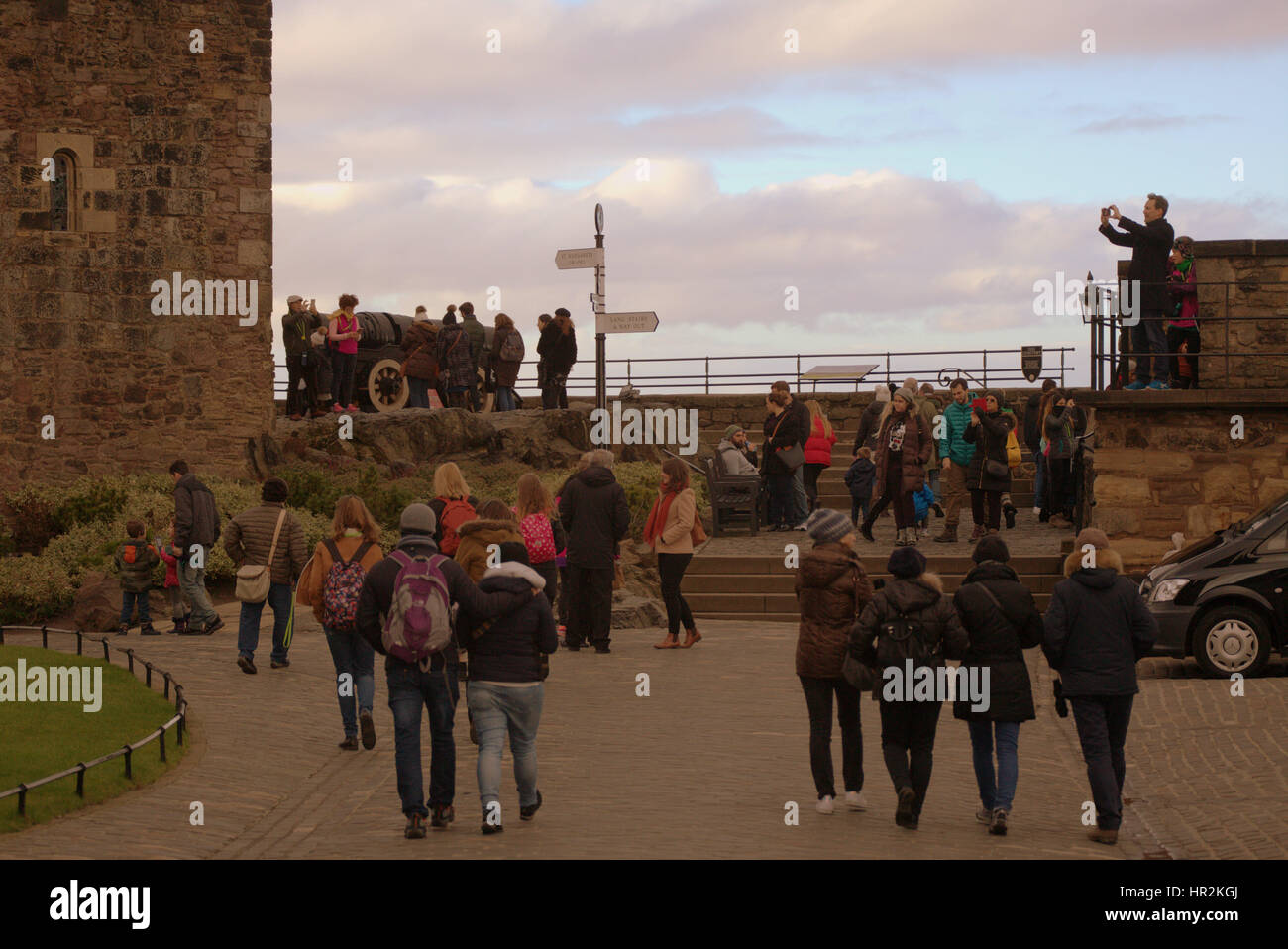 Edinburgh castle tourists on the ramparts inside the castle taking ...