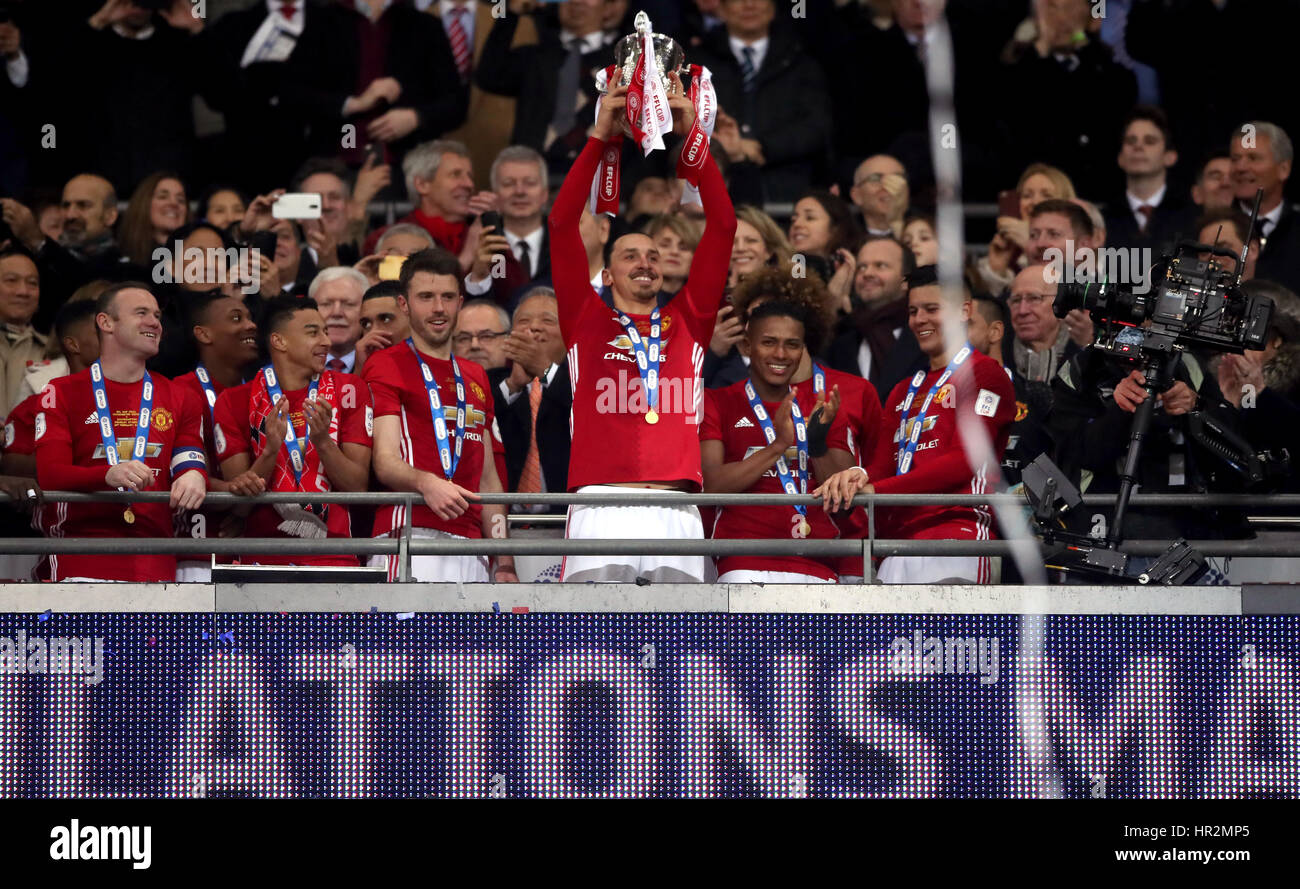 Manchester United's Zlatan Ibrahimovic lifts the trophy after the EFL Cup Final at Wembley Stadium, London. Stock Photo