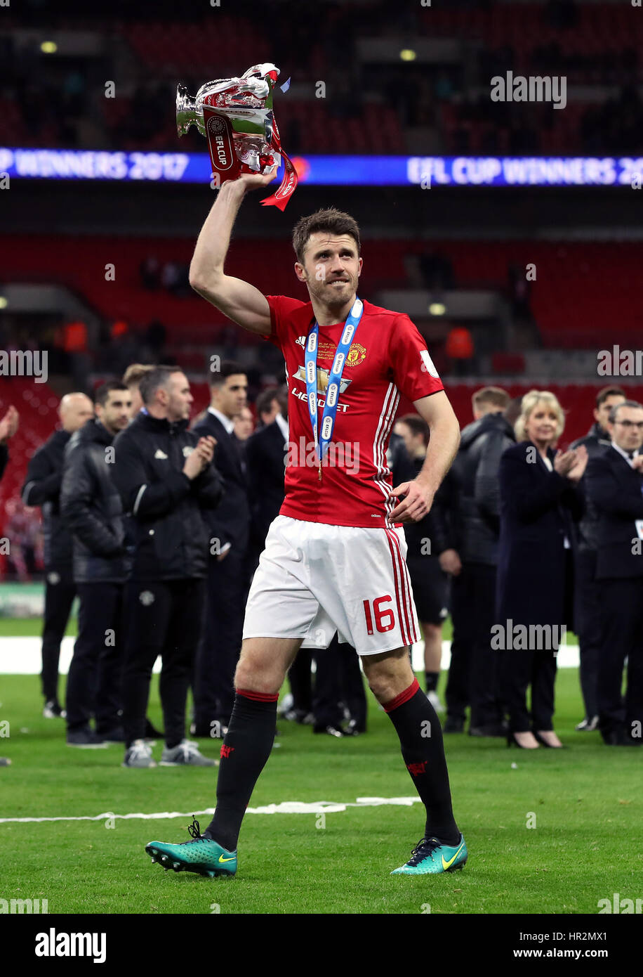 Manchester United's Michael Carrick with the trophy after the EFL Cup Final at Wembley Stadium, London. Stock Photo