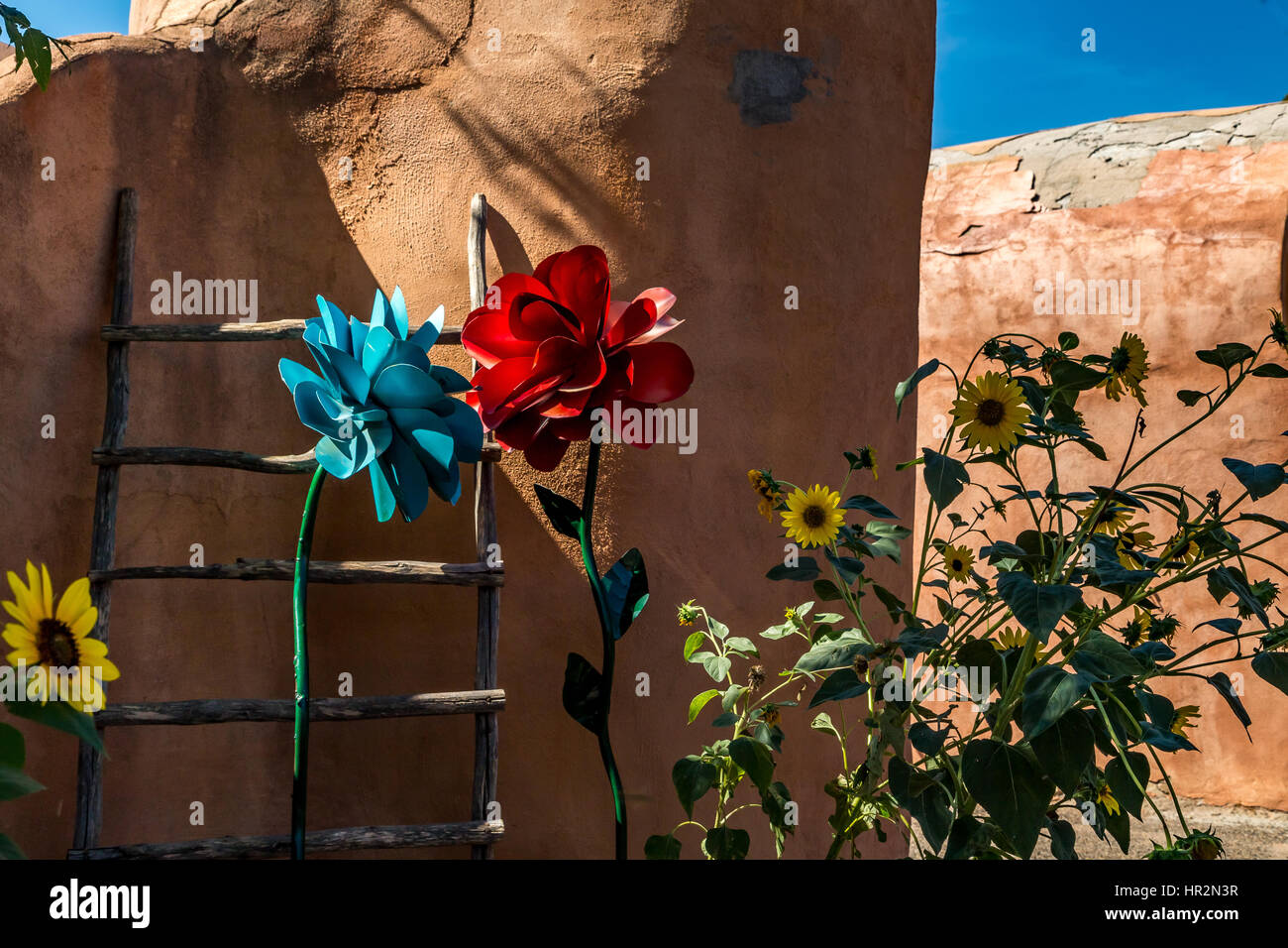 A kiva ladder and a mixture of real and artificial flowers decorate an