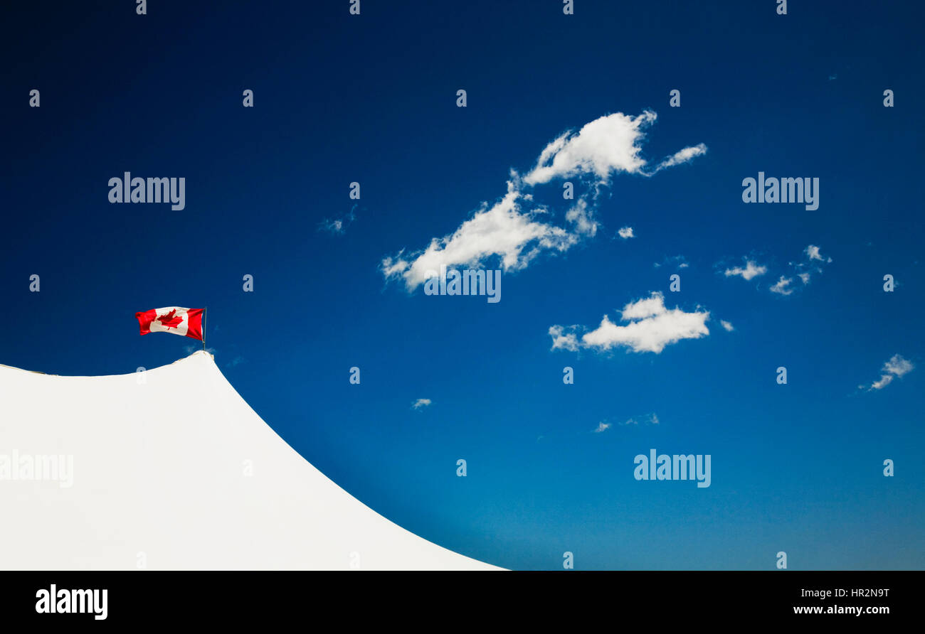 Canadian flag blowing in wind. Calgary Stampede. Calgary, Alberta, Canada Stock Photo