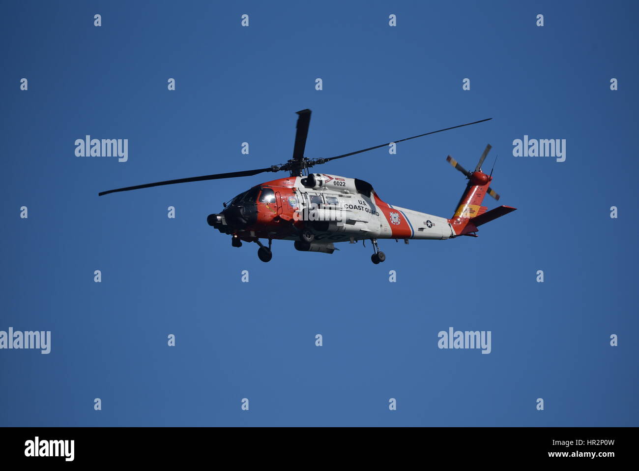HH-60 Jayhawk helicopter used by US Coast Guard in flight over San Diego Harbor, California. Stock Photo