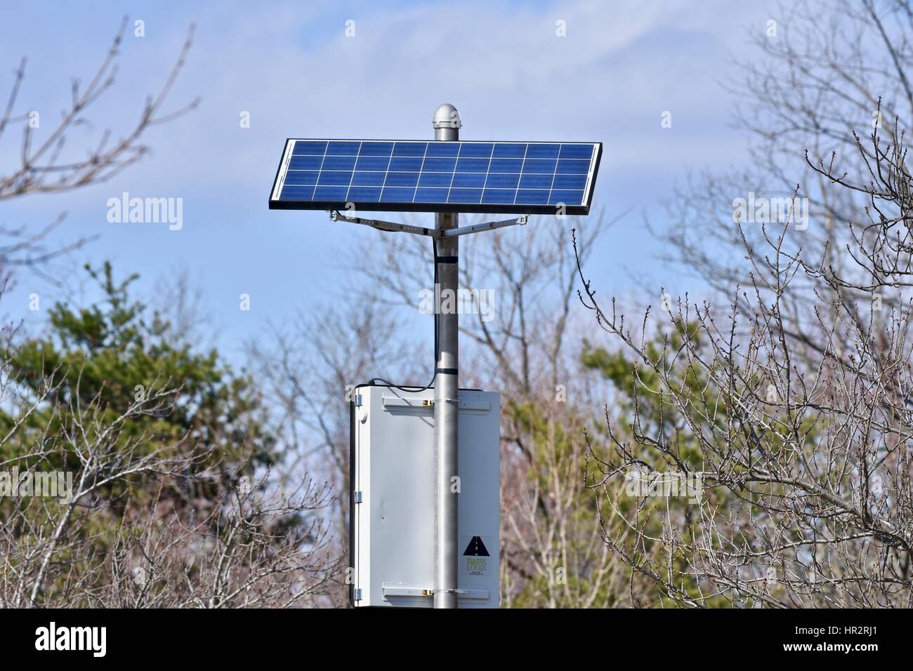 Solar panel powering a speed sign Stock Photo