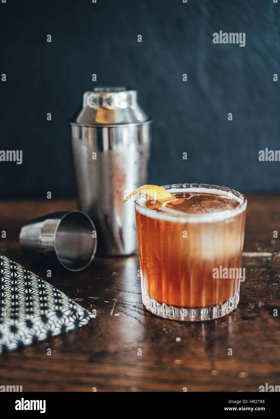 Mixing up an afternoon cocktail, whiskey sour Stock Photo