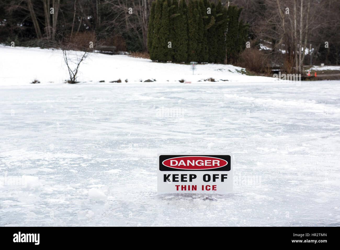 Sign warning of thin ice Stock Photo - Alamy