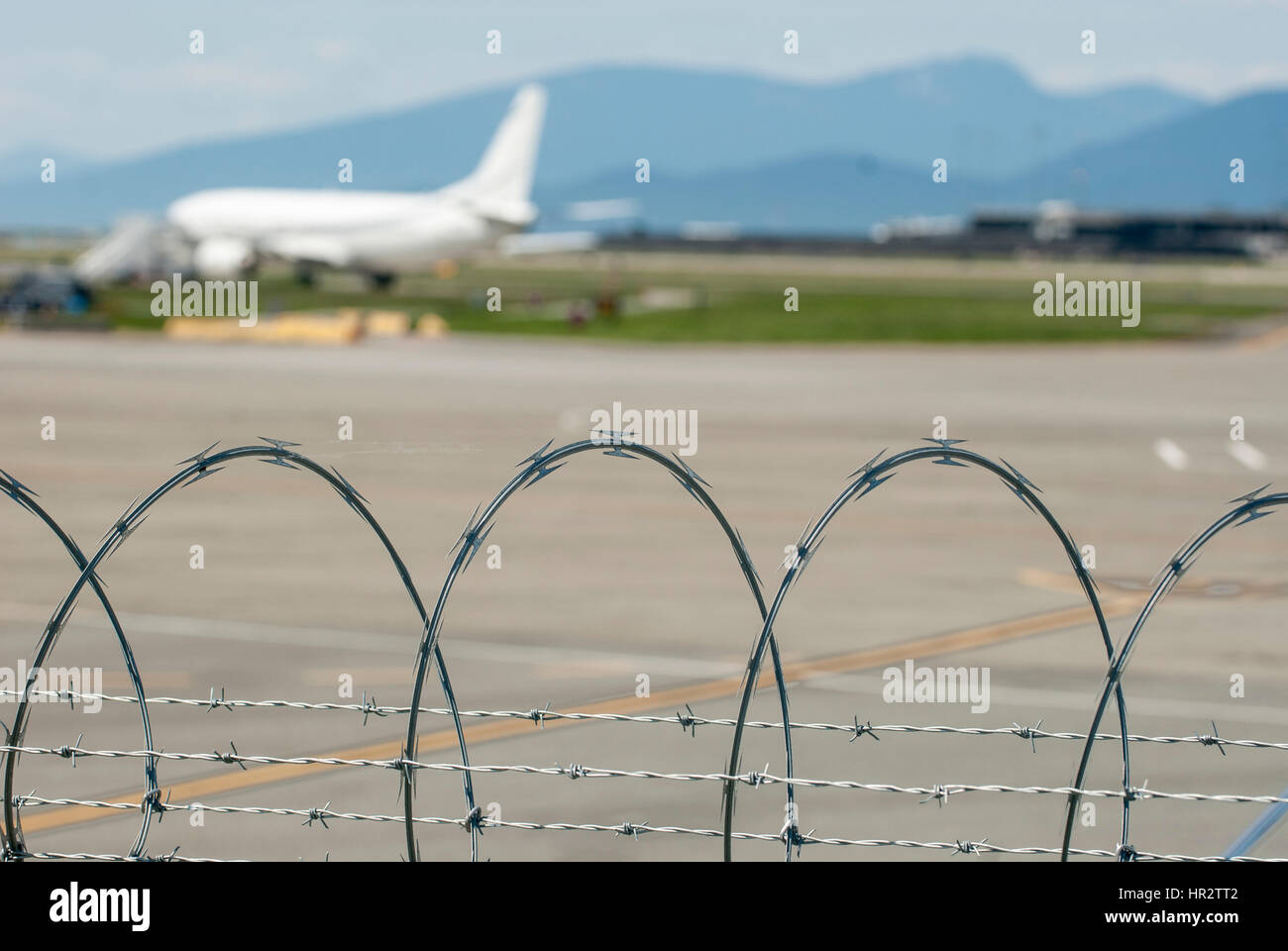 Razor wire used as airport security Stock Photo Alamy