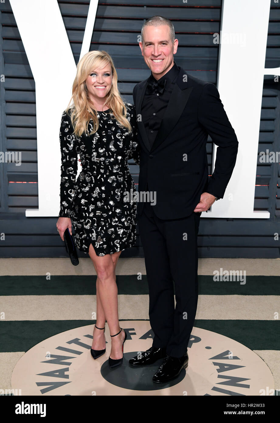 Reese Witherspoon and Jim Toth arriving at the Vanity Fair Oscar Party in Beverly Hills, Los Angeles, USA. Stock Photo
