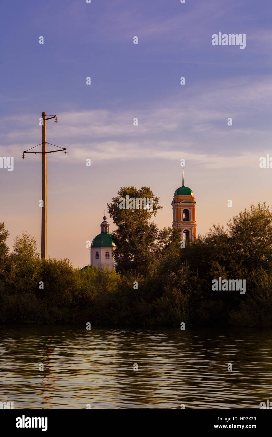 on the water View of the old Russian church in sunset time Stock Photo ...