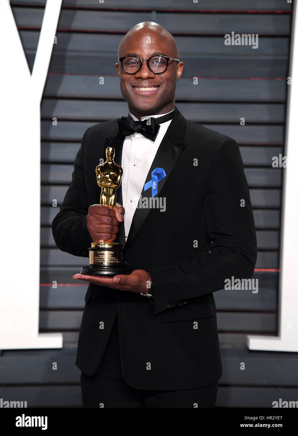 Writer/director Barry Jenkins with his Oscar for Best Adapted Screenplay for Moonlight arriving at the Vanity Fair Oscar Party in Beverly Hills, Los Angeles, USA. Stock Photo