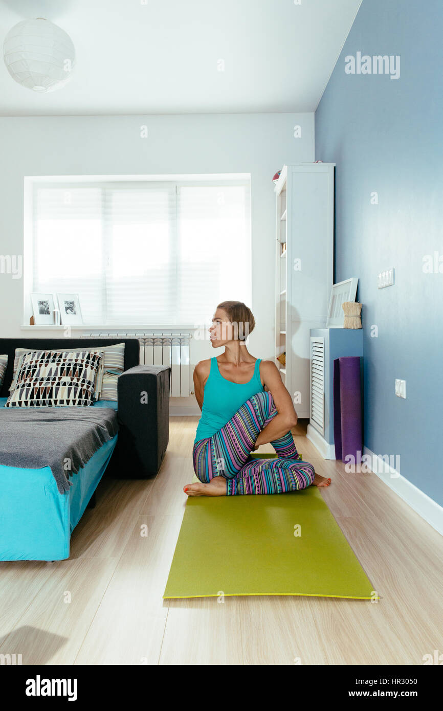 athletic woman practicing yoga on indoor. vertical photo Stock Photo