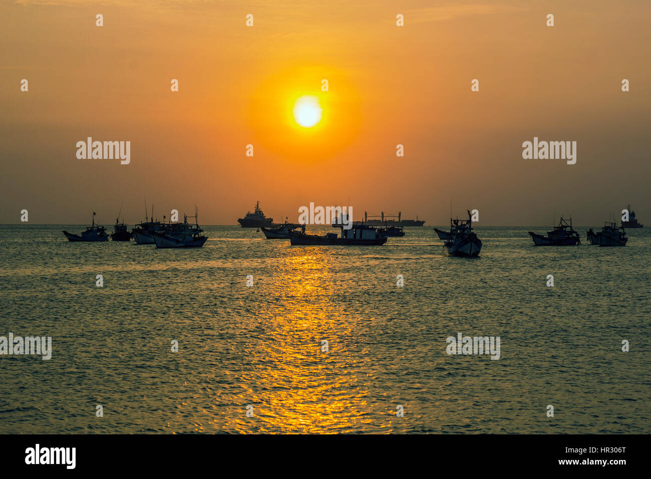 wooden boats silhouettes on a sunset background Stock Photo - Alamy