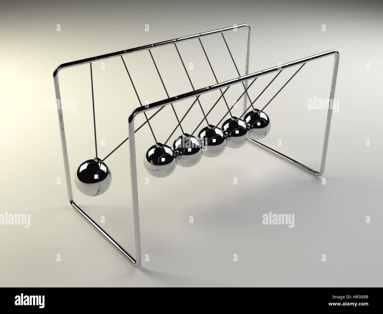 Newton's cradle in motion, silver cradle on white surface Stock Photo