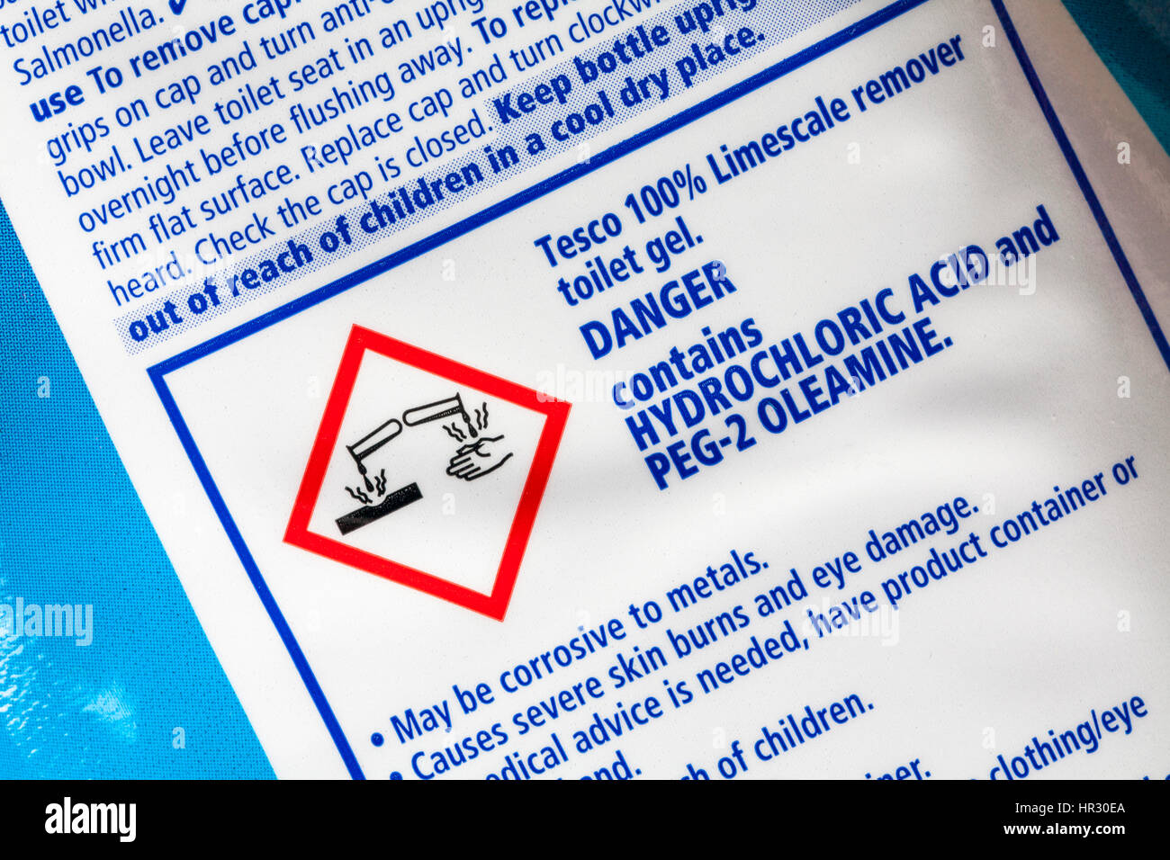 Label on back of Tesco 100% limescale remover toilet gel - danger contains hydrochloric acid and PEG-2 oleamine Stock Photo