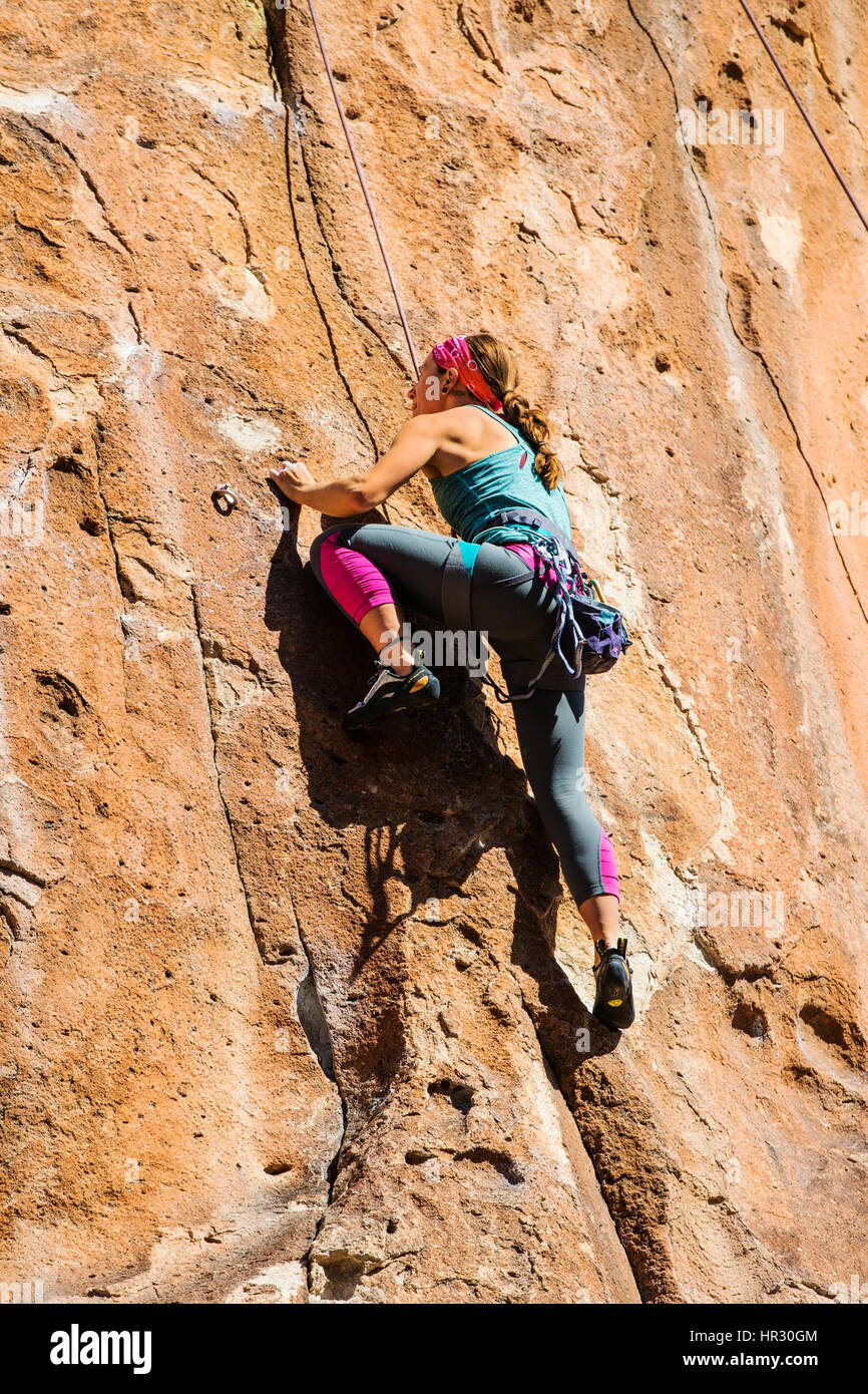 Young woman rock climbing; Penitente Canyon; Colorado; US Stock Photo