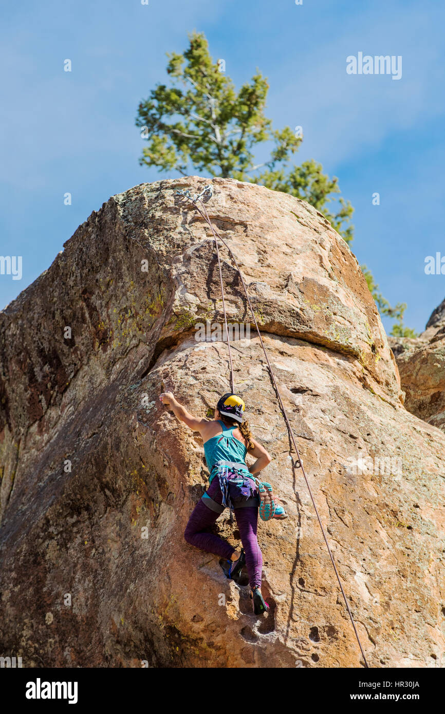 Young woman rock climbing; Penitente Canyon; Colorado; US Stock Photo