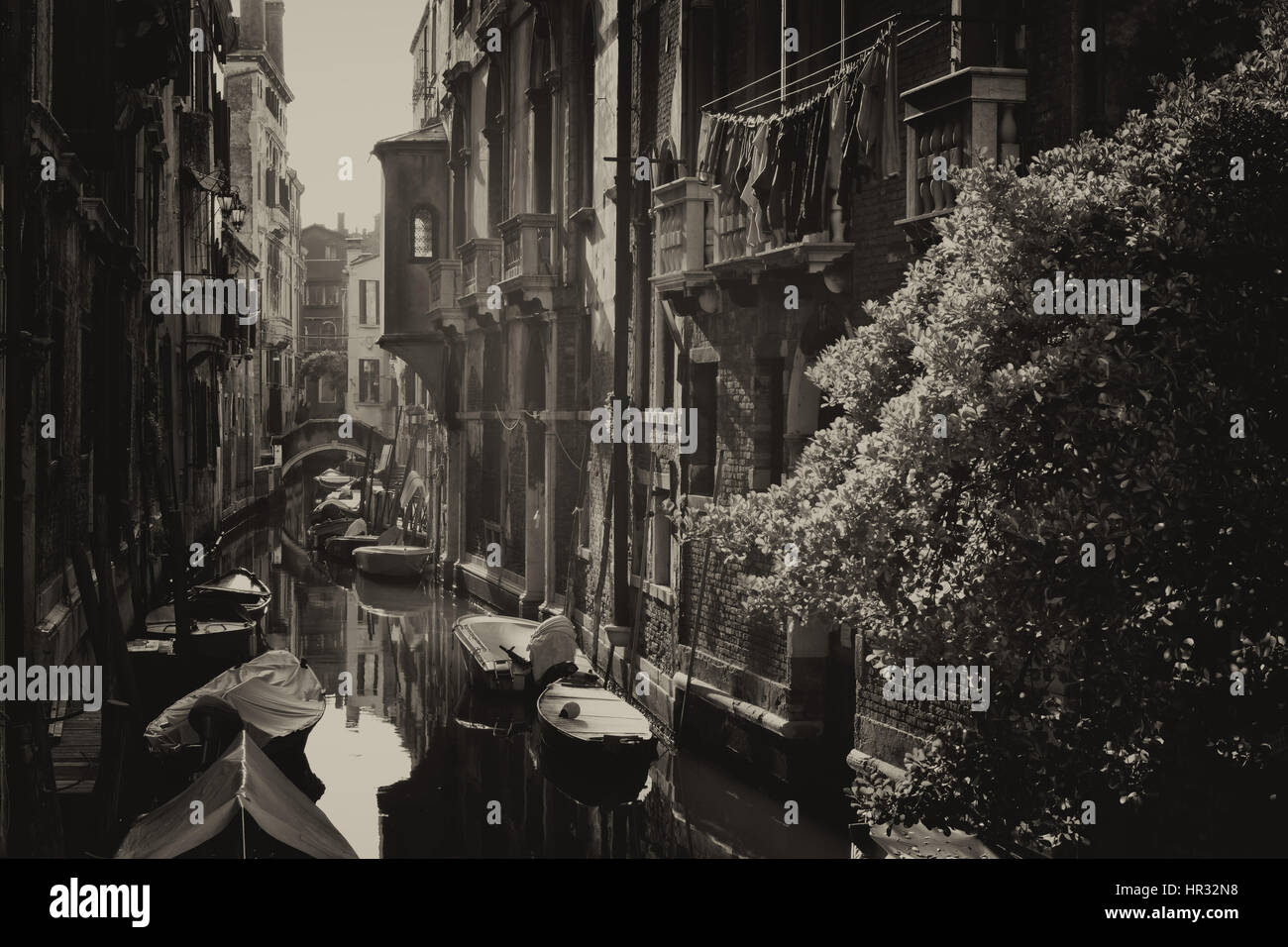 Small canal with boats,  Venice, Italy - digitally altered Stock Photo