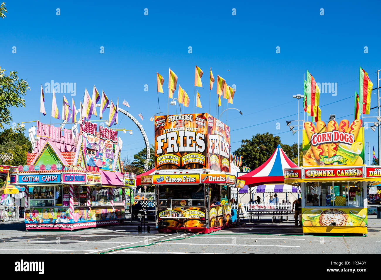 An empty carnival , amusement park, or fair in a parking lot Stock Photo