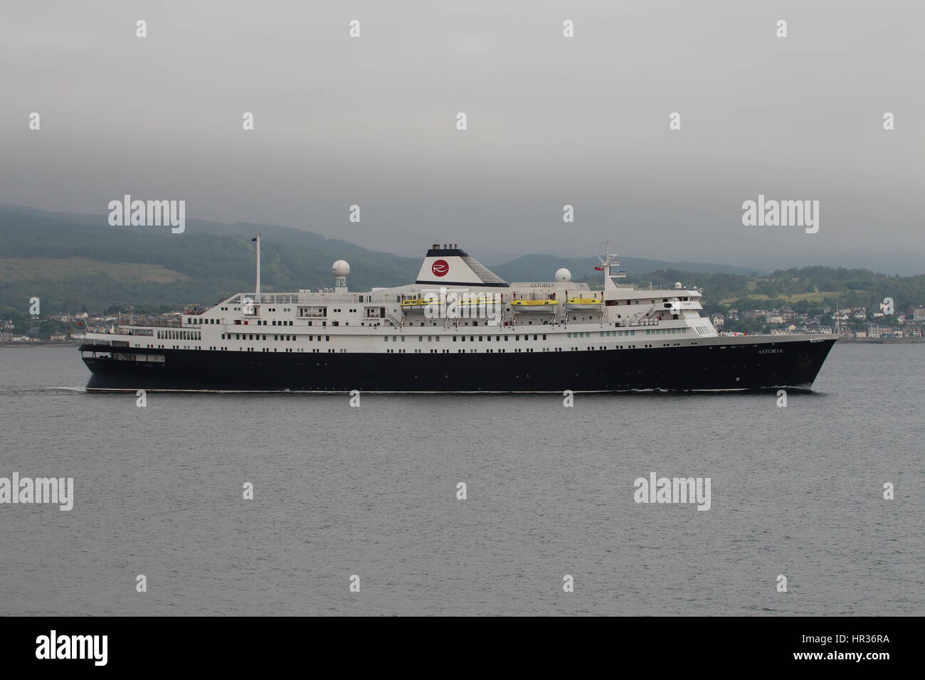 MV Astoria, a cruise ship operated by Cruise and Maritime Voyages, passes Cloch Point on the Firth of Clyde. Stock Photo