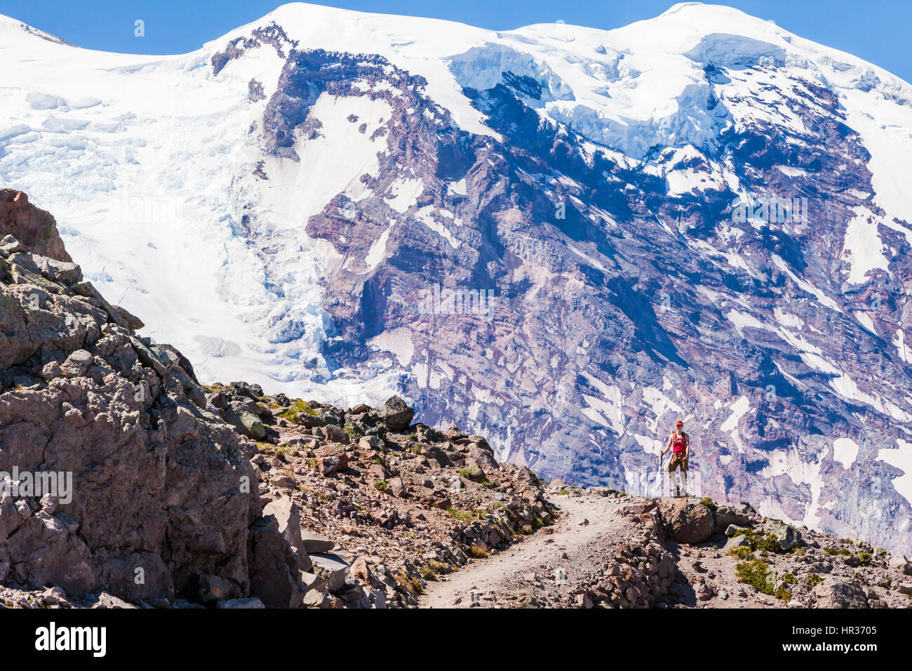 A woman hiking on First Burroughs Mountain below Mount Rainier ...
